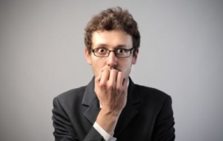 man biting nails