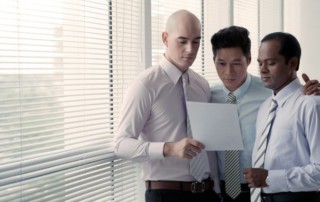 Businessmen checking bankruptcy document