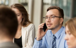 Man making a call in a group of people