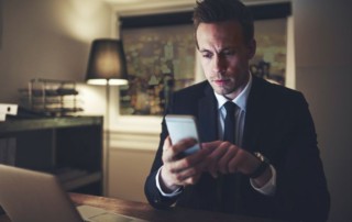 Lawyer checking his phone during night time