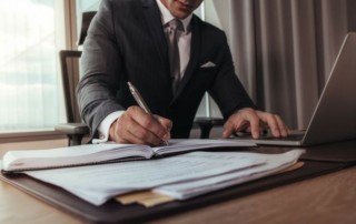 Attorney writing on a piece of paper