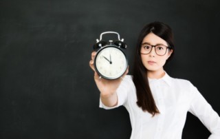 Woman with a clock in her hand