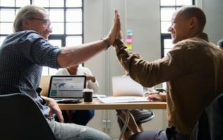 two team members congratulating each other