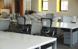 multiple empty desks in an office room