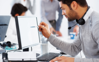 Man checking clients records on computer