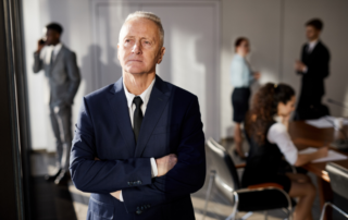 Businessman standing in front of his team