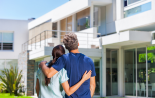 Young couple looking at an expensive property