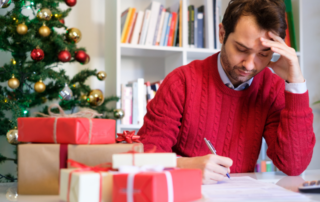 Worried man for overspending for Christmas presents