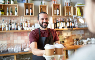 Man serving coffee to go