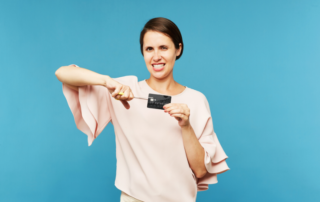 Woman cutting credit card