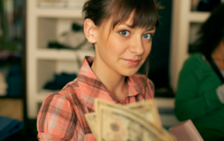 Teenage girl looking at money