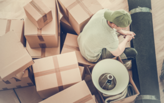 Man surrounded by lots of boxes