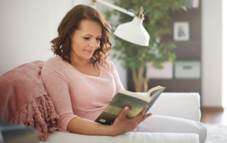 Lady reading on a sofa