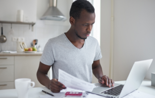 Young man with bills