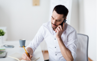 Man talking on the phone with his clients